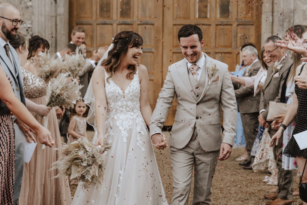 Norfolk wedding photographer capturing confetti at Pentney Abbey in Norfolk