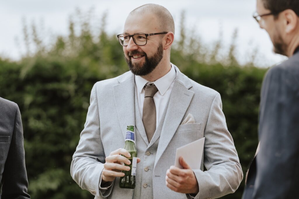 Wedding photographer in Norfolk capturing candids at Pentney Abbey
