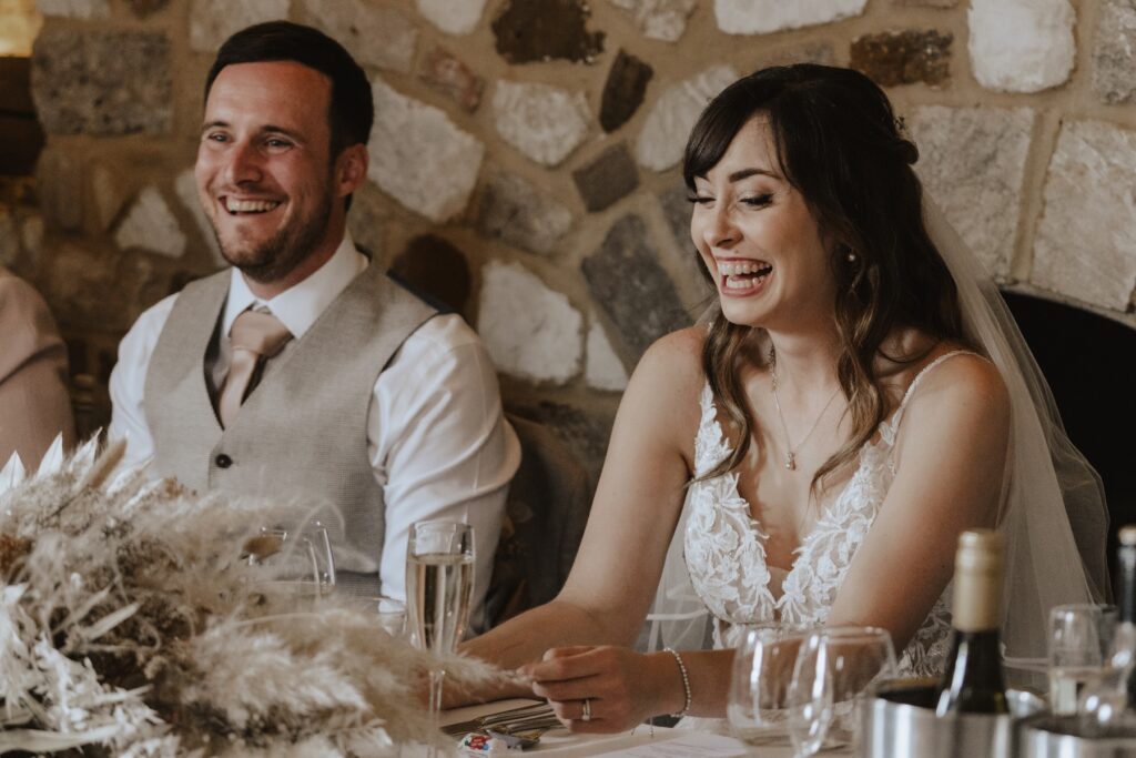Norfolk wedding photographer capturing candids during speeches at Pentney Abbey