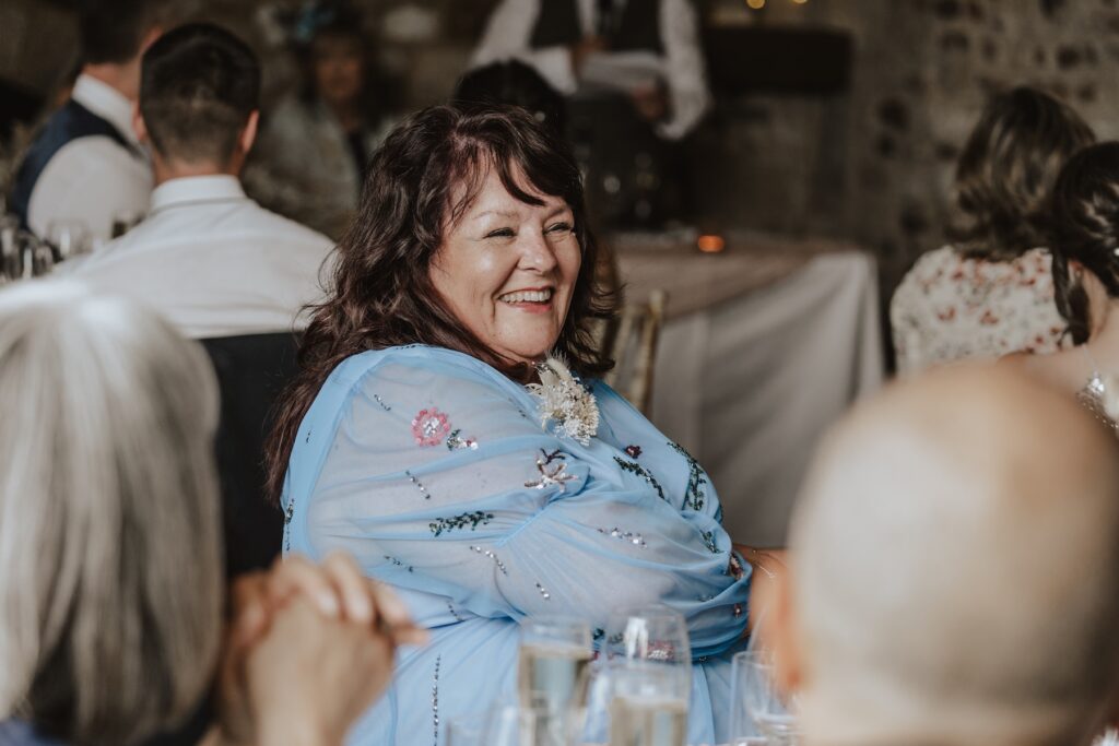 Norfolk wedding photographer capturing candids during speeches at Pentney Abbey