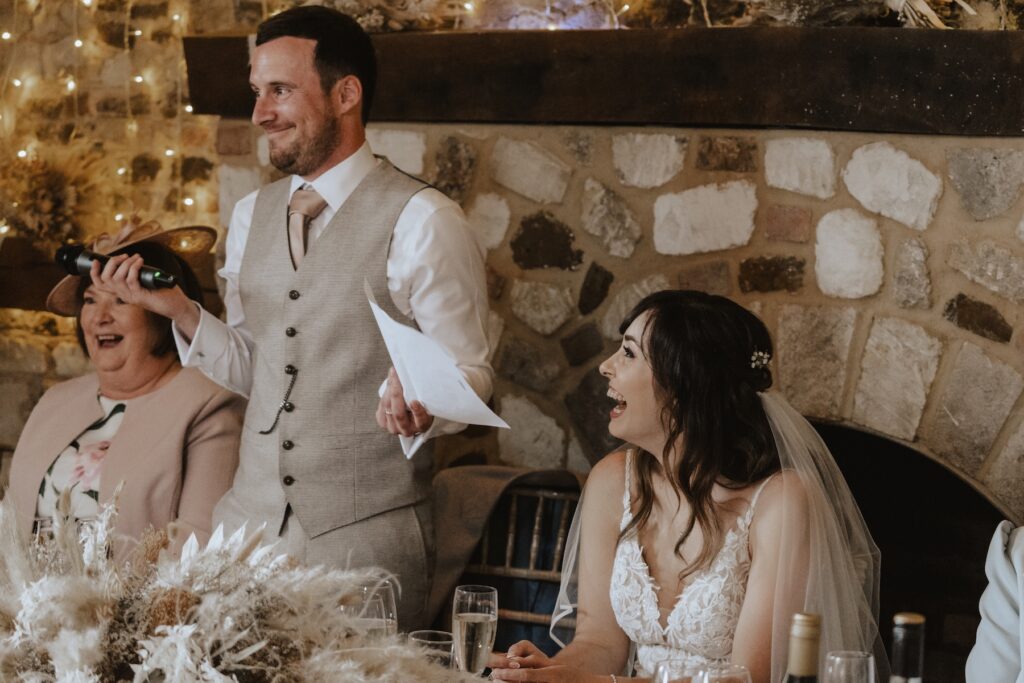 Wedding photographer in Norfolk capturing speeches at Pentney Abbey