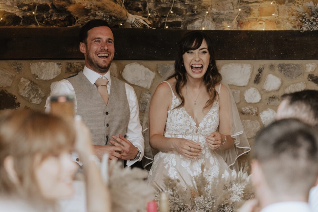 Wedding photographer in Norfolk during speeches at Pentney Abbey