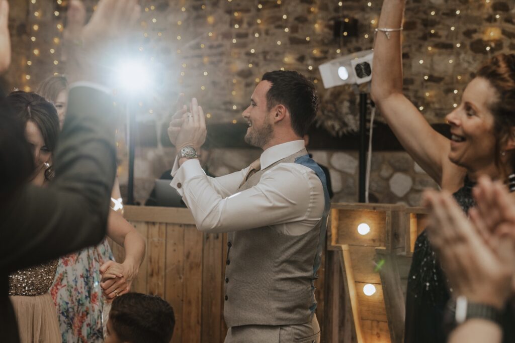 Norfolk wedding photographer capturing moments on the dance floor at Pentney Abbey