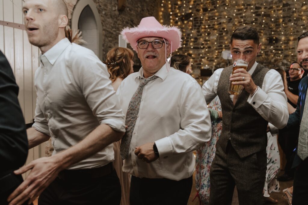 Wedding photographer in Norfolk capturing guests on the dance floor at Penntey Abbey