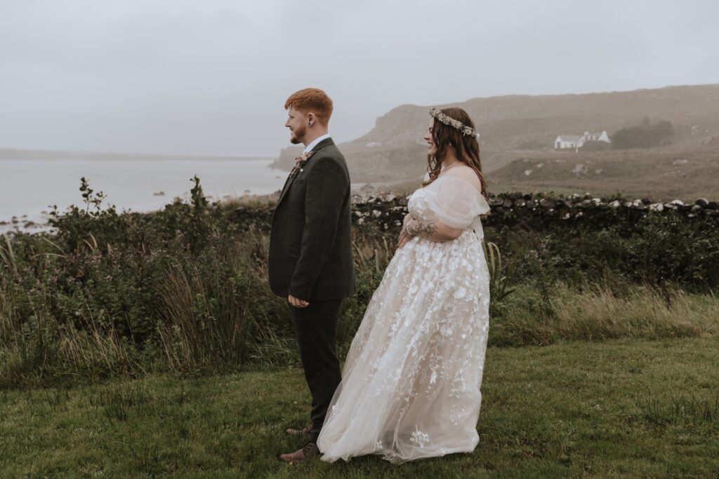 The bride and groom having a first look on the Isle of Skye on their elopement