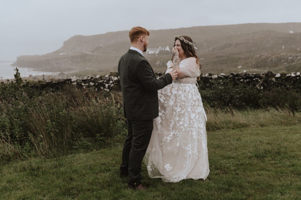 Scotland elopement photographer capturing a couple have their first look on the Isle of Skye