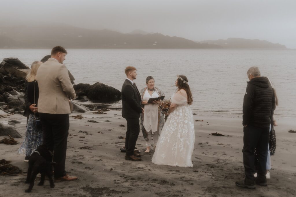 Scotland elopement photographer capturing the couple eloping on An Corran beach on the Isle of Skye