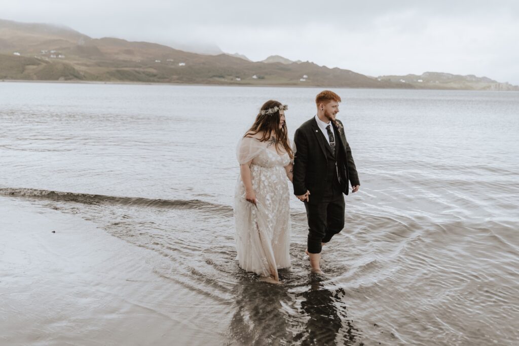 A couple on An Corran Beach eloping on the Isle of Skye in Scotland