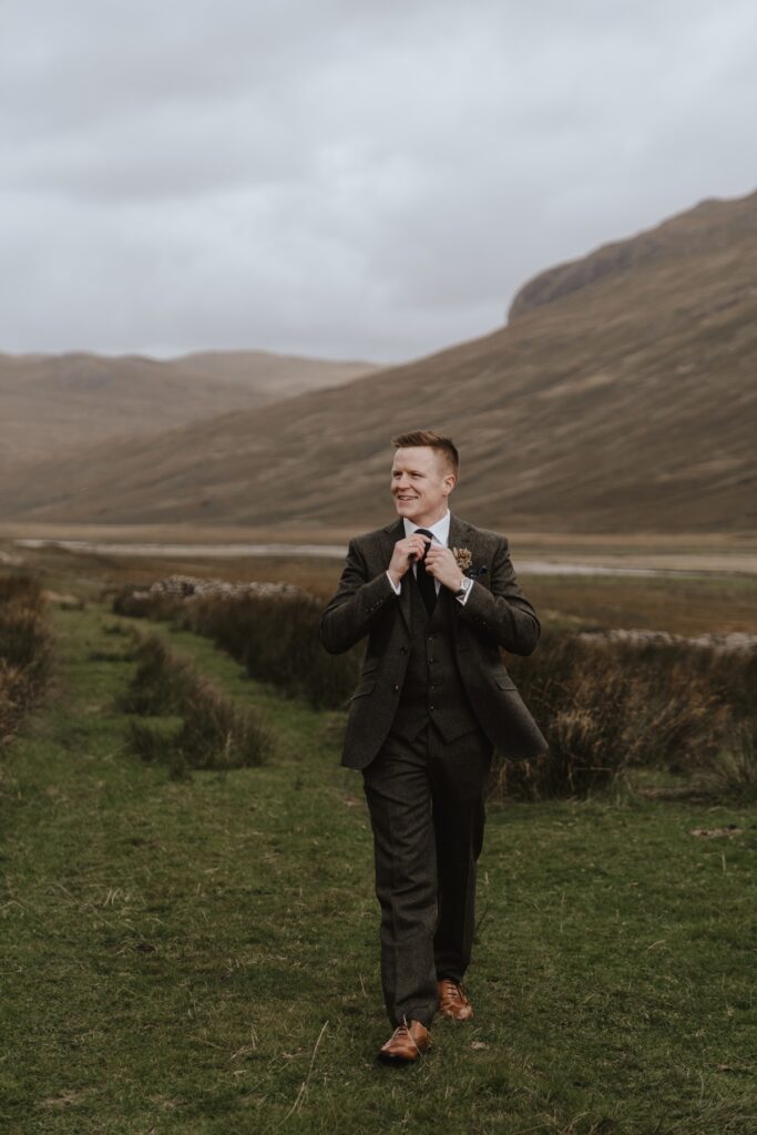 Scotland elopement photographer capturing grooms prep during an Isle of Mull elopement