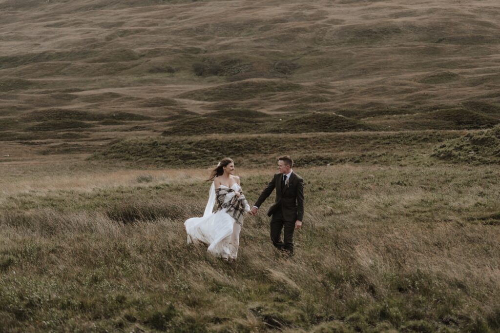 Scotland elopement photographer capturing portraits of the couple as they explore the Isle of Mull landscape on their elopement