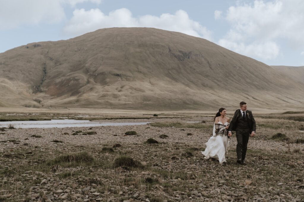 A couple exploring Scotland during their elopement