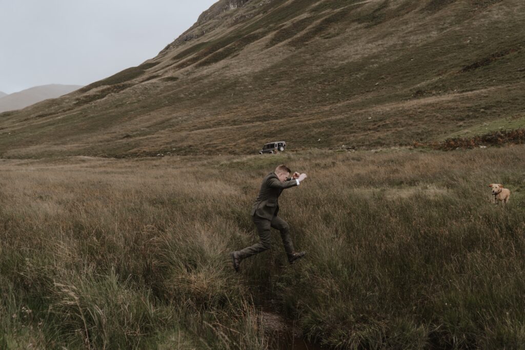 The couple during their Scotland elopement exploring the landscape