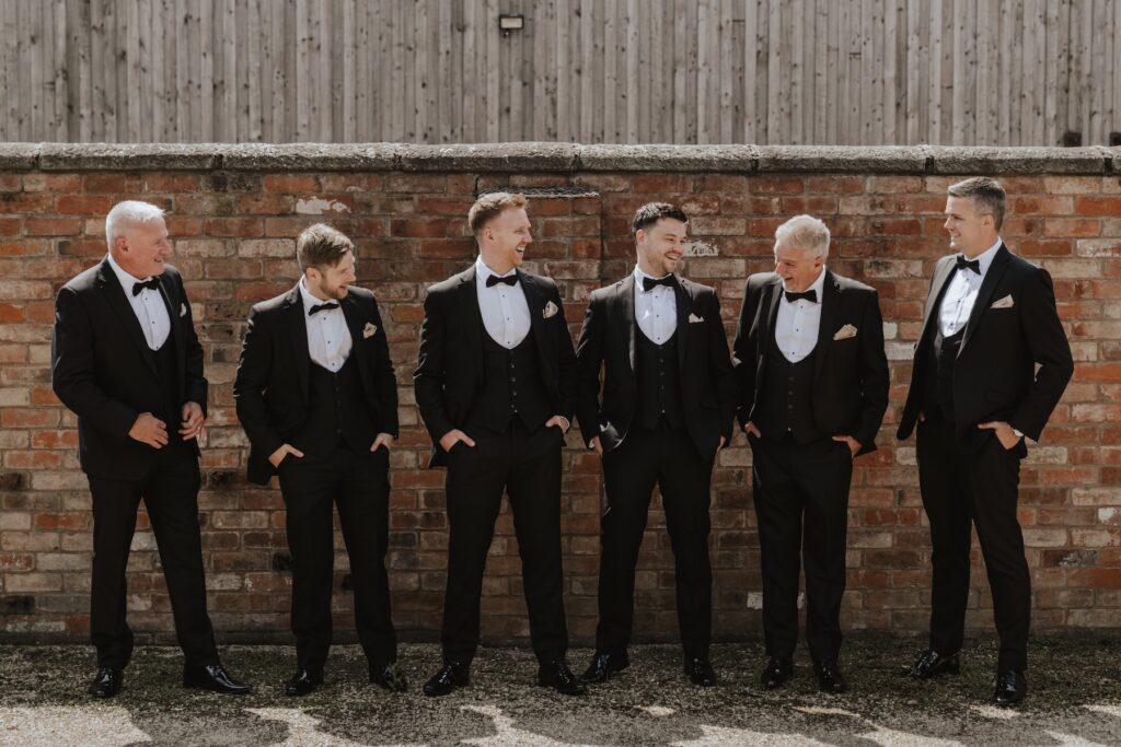 The groom and his groomsmen whilst getting ready at Swallows Nest Barn