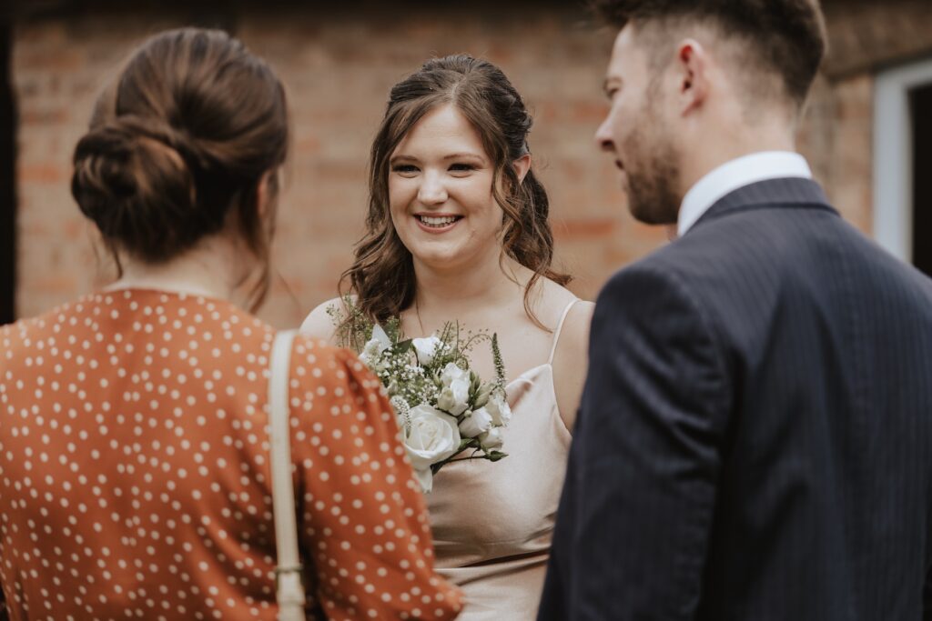 Swallows Nest Barn wedding photographer capturing candids during drinks reception at Swallows Nest Barn