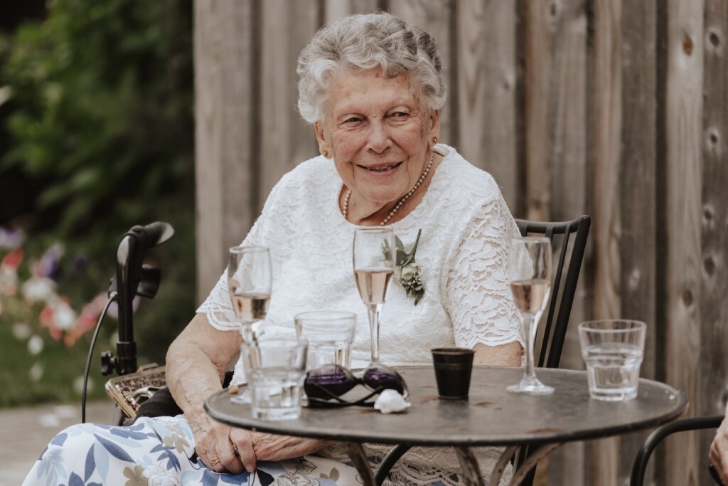 Warwickshire wedding photographer capturing candids during the drinks reception at Swallows Nest Barn