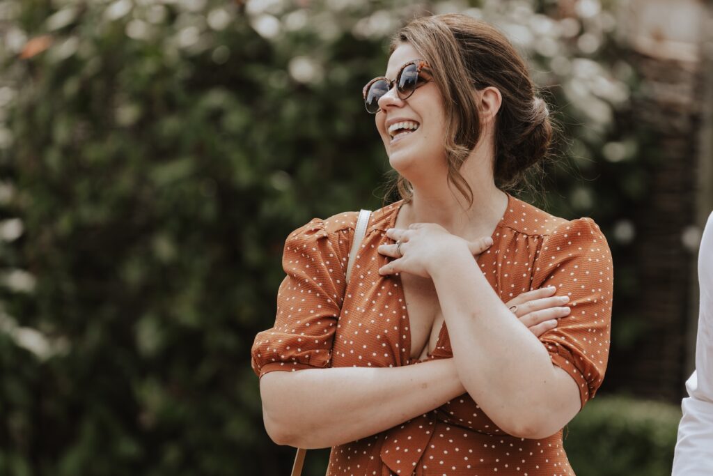 Northamptonshire wedding photographer capturing candids during drinks reception at Swallows Nest Barn