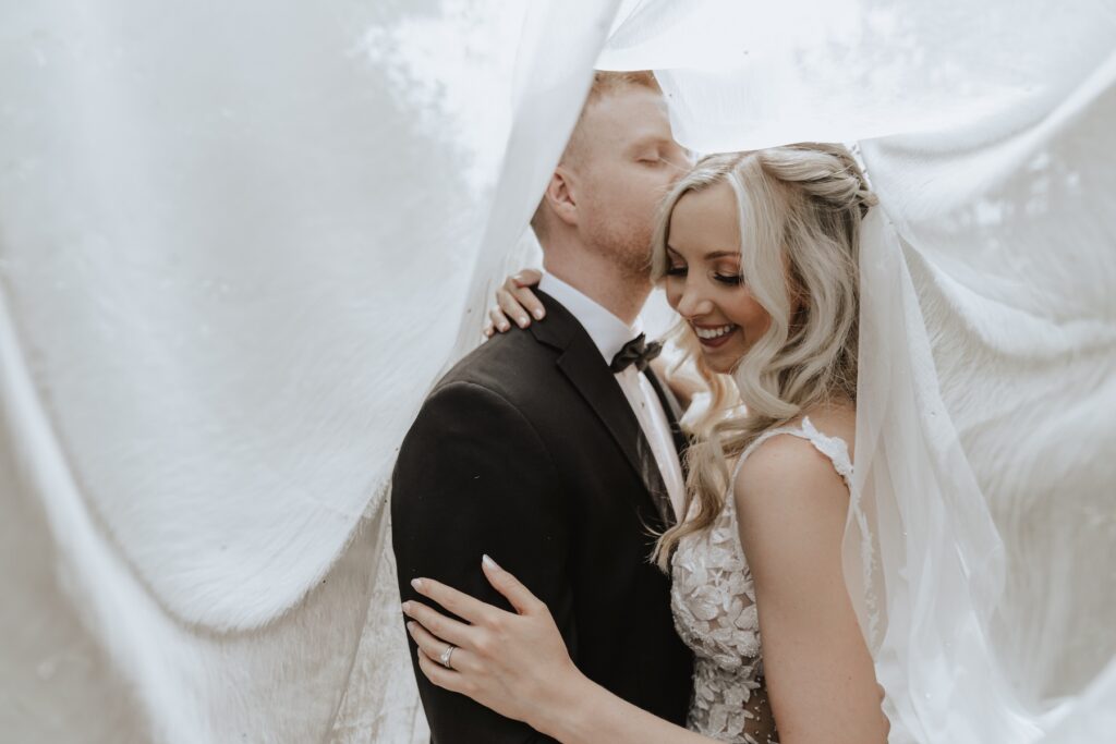 Veil photos with the couple at Swallows Nest Barn in Northamptonshire