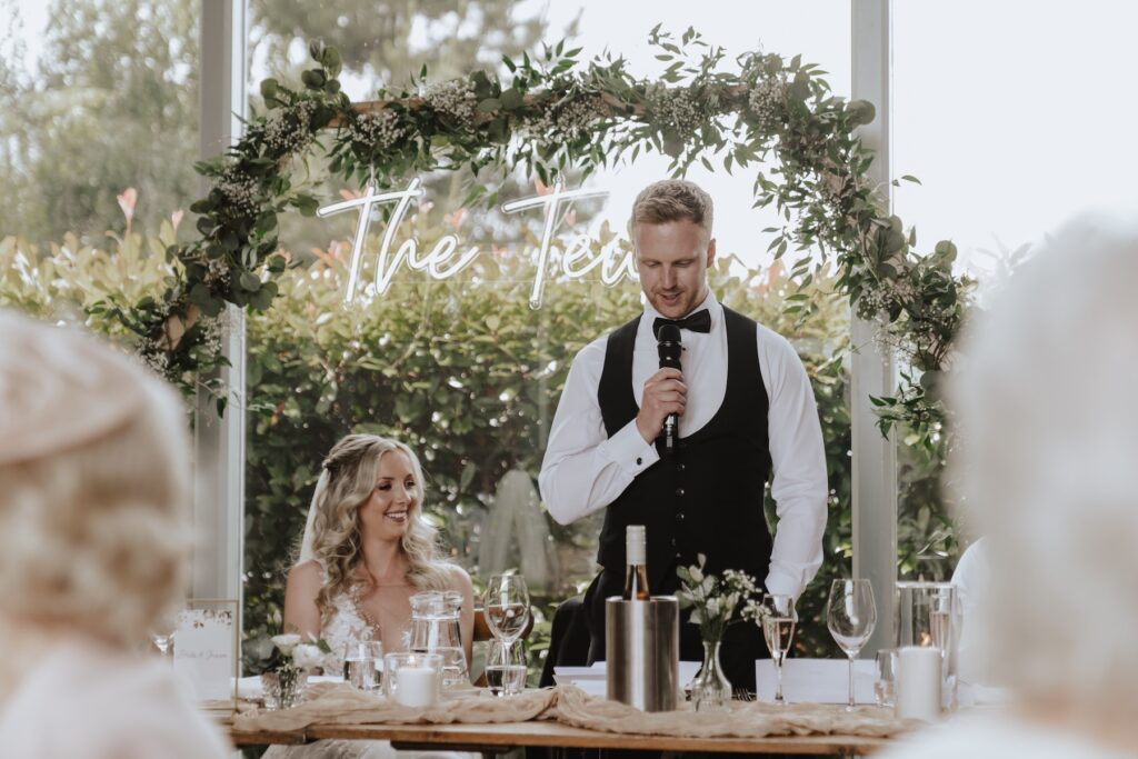 Warwickshire wedding photographer capturing speeches at Swallows Nest Barn