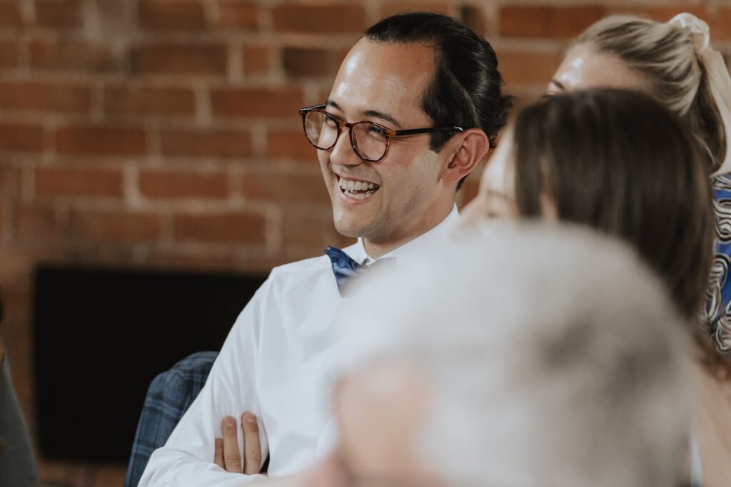 Northamptonshire wedding photographer capturing candids of guests at Swallows Nest Barn