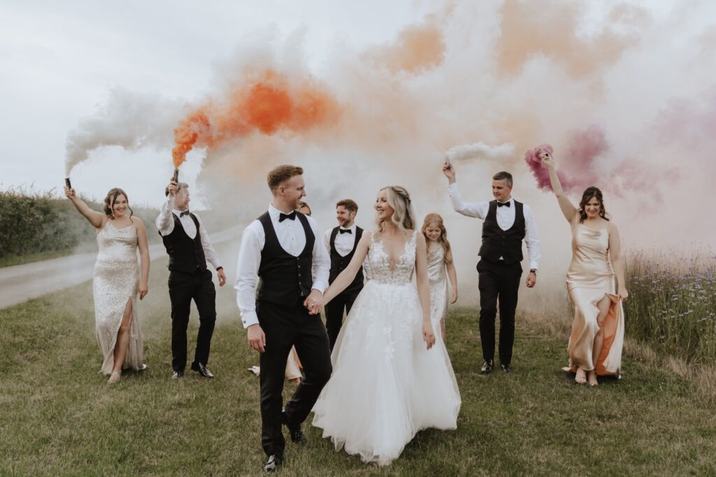 Northamptonshire wedding photographer capturing moments in the evening with the bridal party at Swallows Nest Barn