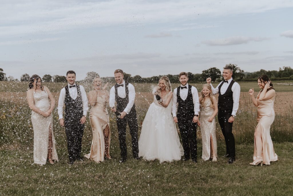 Swallows Nest Barn capturing moments with bridesmaids and groomsmen in Northamptonshire
