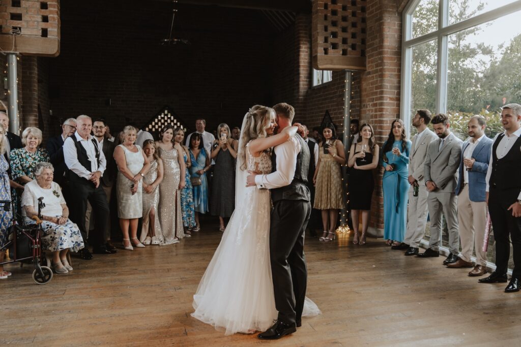 Northamptonshire wedding photographer capturing a newlywed couples first dance at Swallows Nest Barn