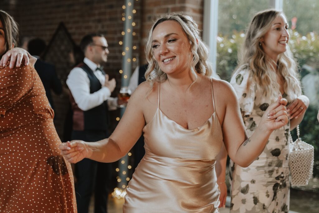 Northamptonshire wedding photographer capturing dance floor moments at Swallows Nest Barn