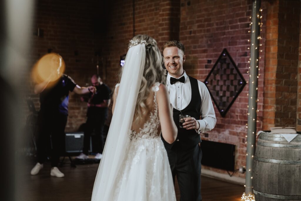 Warwick wedding photographer capturing dance floor moments at Swallows Nest Barn