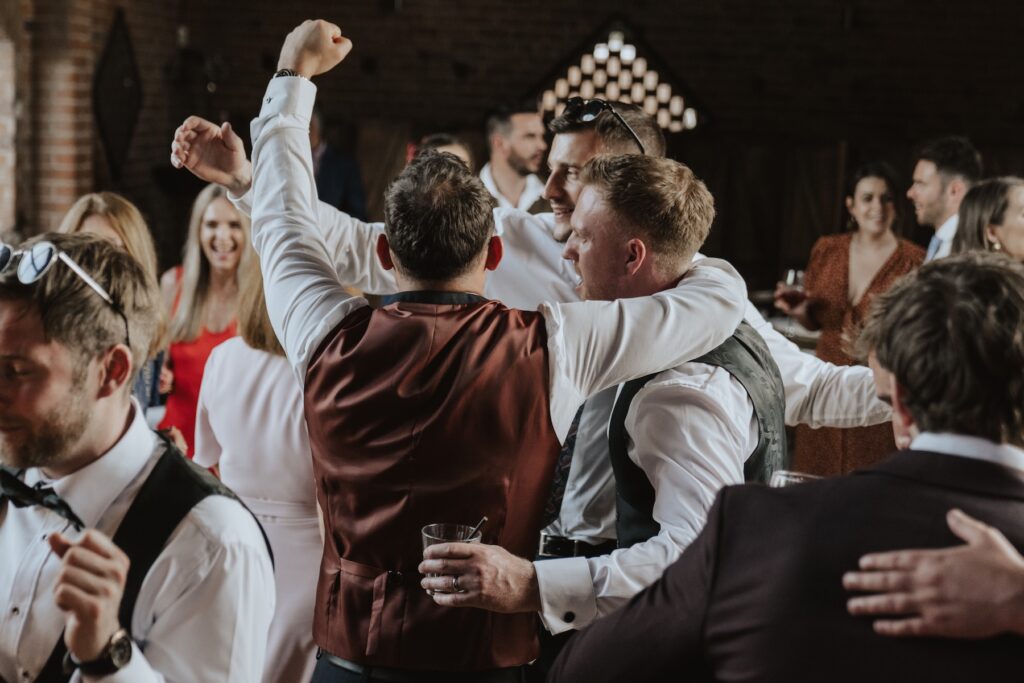Warwick wedding photographer capturing evening dance floor moments at Swallows Nest Barn