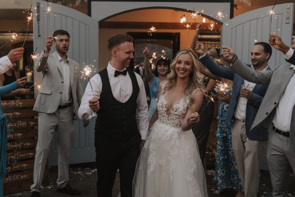 Northamptonshire wedding photographer capturing sparklers in the evening at Swallows Nest Barn