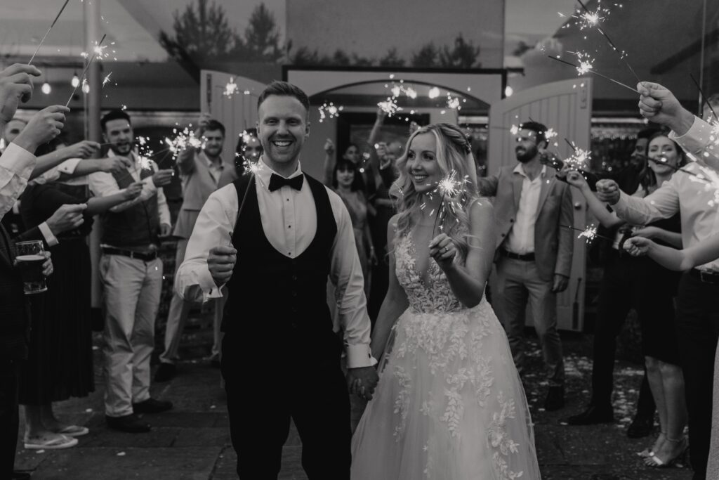 Northamptonshire wedding photographer capturing sparklers in the evening at Swallows Nest Barn in Warwick