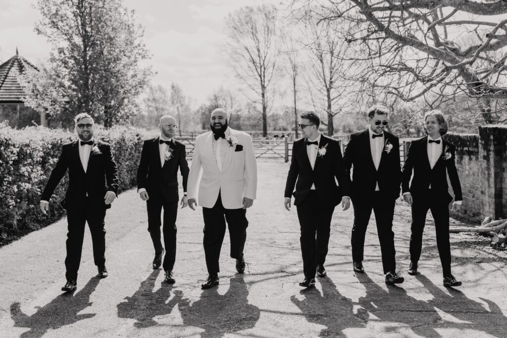 Fun groomsmen photos at All Manor of Events in Suffolk