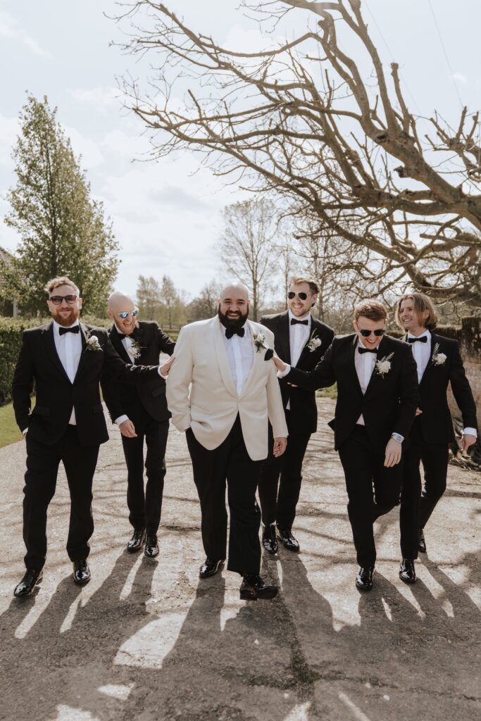 The groom and his groomsmen getting ready at All Manor of Events in Suffolk