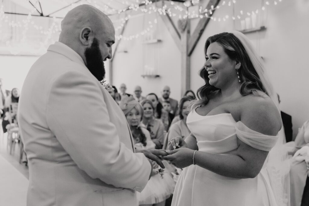 The couple during their ceremony at All Manor of Events in Suffolk