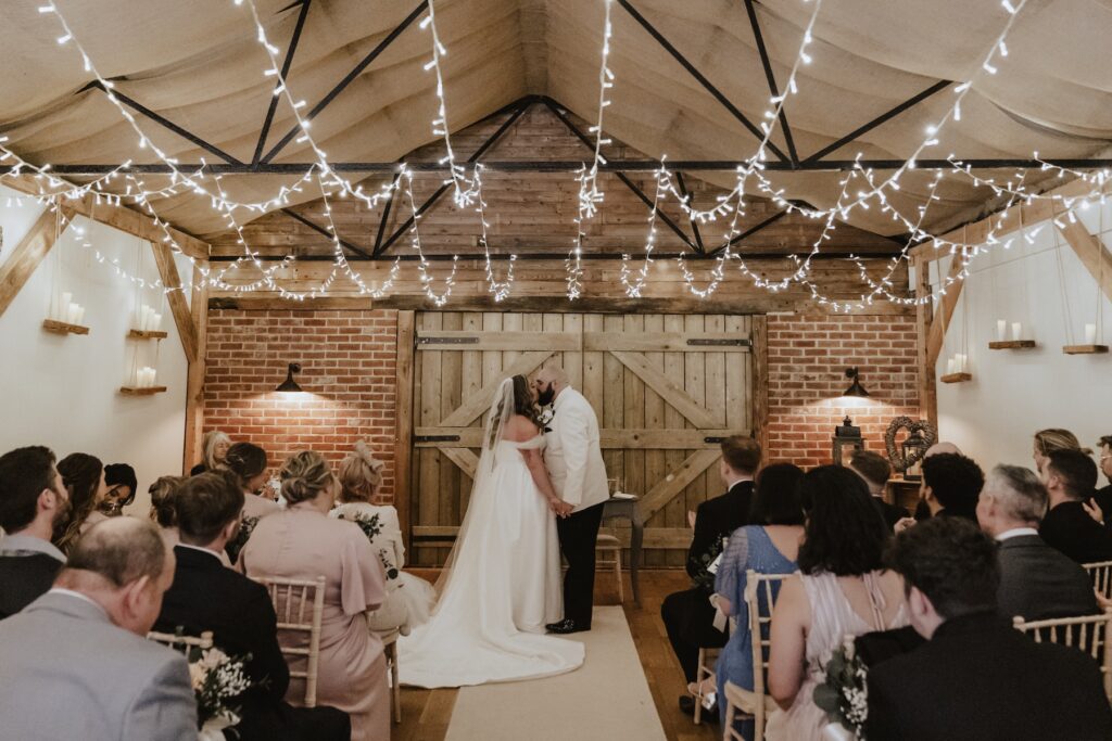 The couple during the ceremony at All Manor of Events in Suffolk
