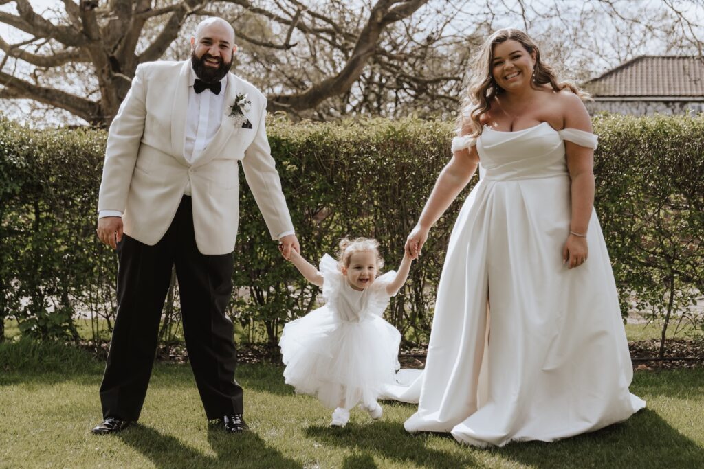 Wedding portraits with the couple and their child at All Manor of Events in Suffolk