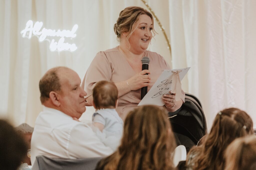 A bridesmaid doing a speech at All Manor of Events in Suffolk