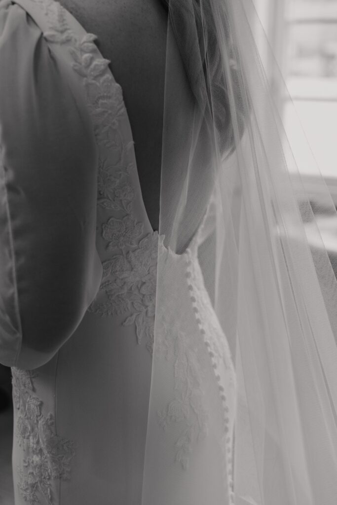 The bride's dress and veil at Bassmead Manor Barns in Cambridgeshire