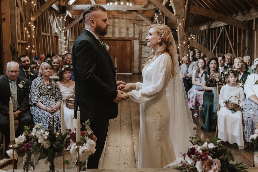 The couple during their ceremony at Bassmead Manor Barns in St Neots