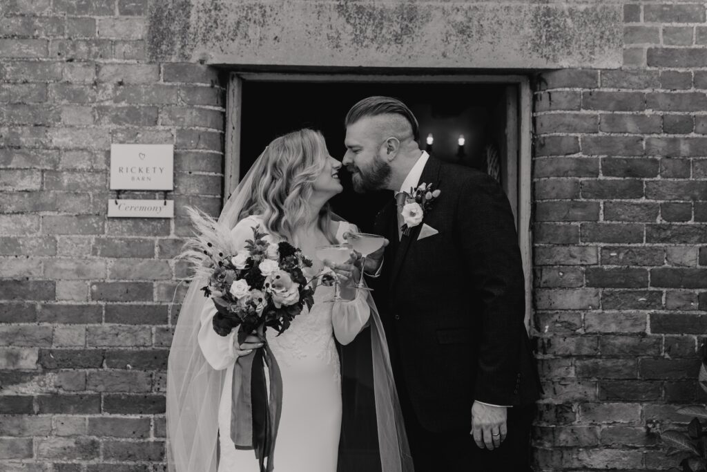 Candid moments of a newlywed couple after their ceremony at Bassmead Manor Barns in Cambridge