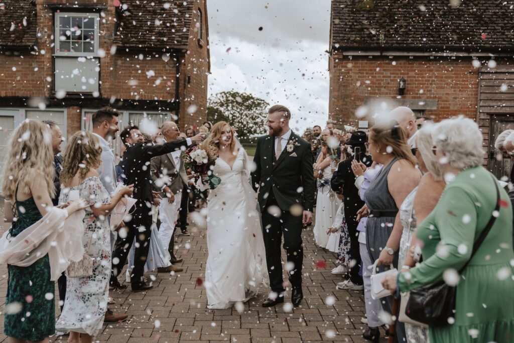 Confetti moment at Bassmead Manor Barns in Cambridgeshire