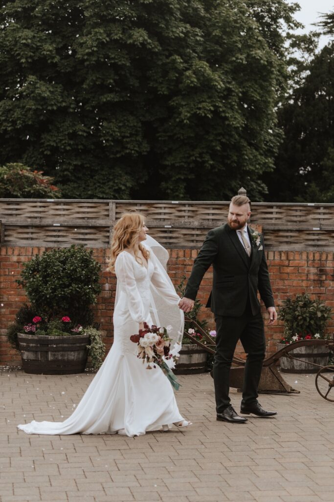 Wedding portraits of the couple at Bassmead Manor Barns in Cambridgeshire