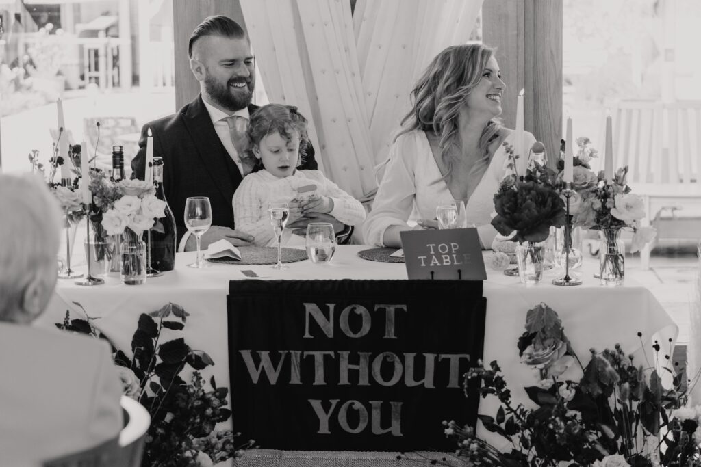 Candids of the couple during wedding speeches at Bassmead Manor Barns in Cambridgeshire