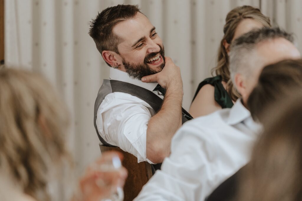 Cambridge wedding photographer capturing speech candids at Bassmead Manor Barns