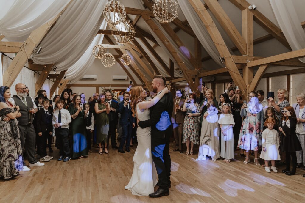 The couple having their dance floor in the evening barn at Bassmead Manor Barns in Cambridgeshire