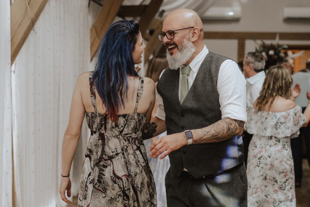 Guests on the dance floor during the wedding party at Bassmead Manor Barns in Cambridgeshire