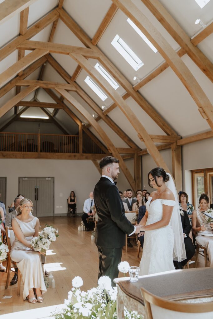 Easton Grange wedding in Suffolk during the ceremony at the ceremony barn