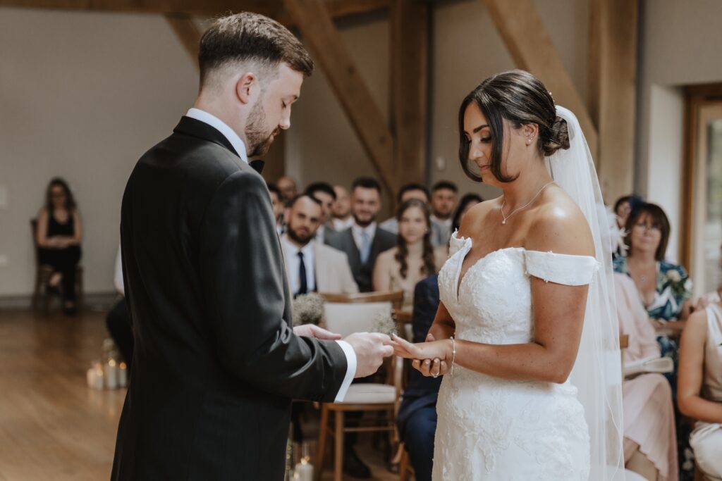 Suffolk wedding photographer capturing a couple during their ceremony at Easton Grange in Suffolk