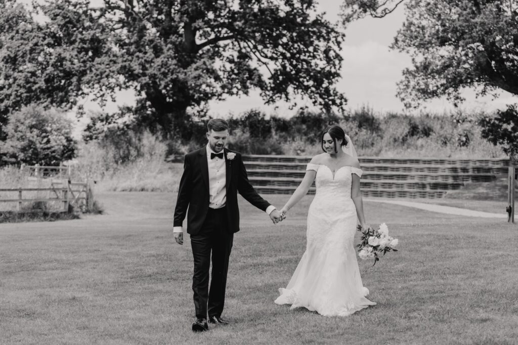 Suffolk wedding photographer capturing wedding portraits of a couple at Easton Grange
