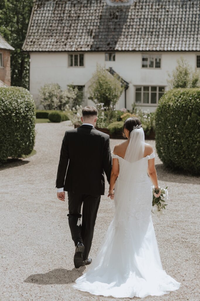 Eason Grange wedding photographer capturing day portraits of a newlywed couple at Easton Grange in Suffolk